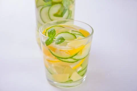 Refreshing summer drink with lemon, ginger, fresh cucumber and mint. Photos