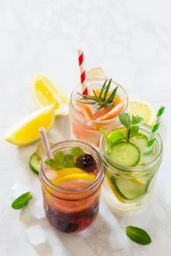 Refreshing summer drinks with blackberries, grapefruit, lemon and mint, water. Stock Photos