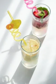 Refreshing summer drinks with lemon and strawberry mint Stock Photos