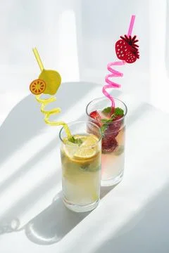 Refreshing summer drinks with lemon and strawberry Stock Photos