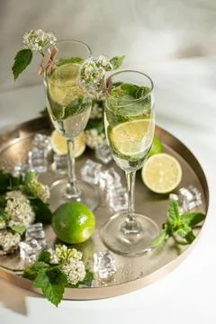 Refreshing summer drinks with lime mint and ice Stock Photos