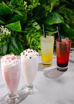 Refreshing summer drinks with milkshakes and fruit beverages Stock Photos