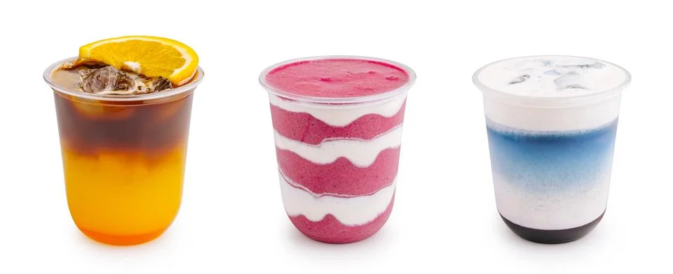 Refreshing summer drinks in plastic cups on white background Stock Photos