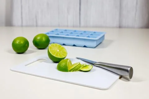 Refreshing Summer Lemonade: Preparing Ice and Slicing Limes for Cocktails Stock Photos
