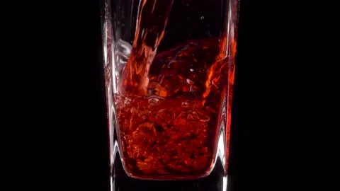 Refreshing. Super slow motion shot of pouring pomegranate juice into a Stock Footage 147413919