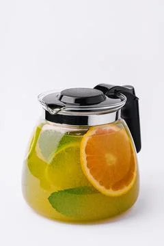 Refreshing tea with lime and orange and mint Stock Photos