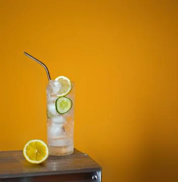 Refreshing tonic and gin Tom Collins cocktail or lemonade with lemon ice and  Stock Photos