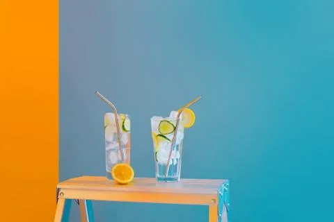 Refreshing tonic and gin Tom Collins cocktail or lemonade with lemon ice and  Stock Photos