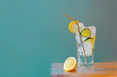 Refreshing tonic and gin Tom Collins cocktail or lemonade with lemon ice and  Stock Photos