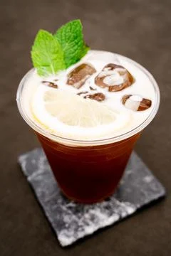 Refreshing tonic with ice and a slice of lemon. Stock Photos