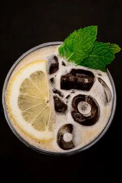 Refreshing tonic with ice and a slice of lemon. Stock Photos