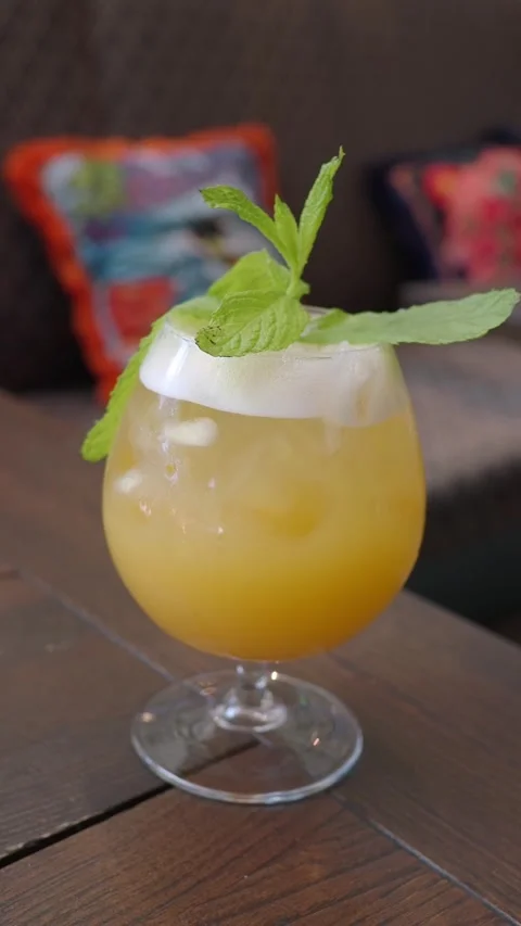 Refreshing tropical drink with mint is a delight Stock Footage 338321842