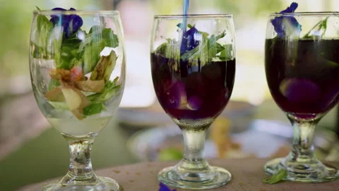 Refreshing tropical drink preparation with mint, ginger, and turmeric using a Stock Footage 301541606