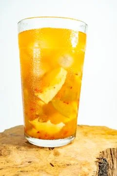 Refreshing tropical fruit pickle featuring sliced young mango, bilimbi, and l Foto stock