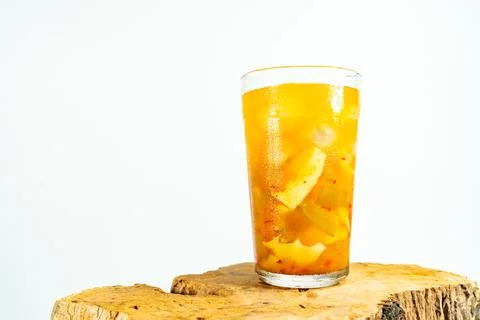 Refreshing tropical fruit pickle featuring sliced young mango, bilimbi, and l Stock Photos