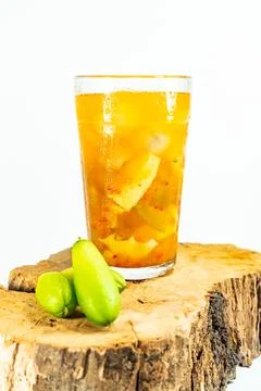 Refreshing tropical fruit pickle featuring sliced young mango, bilimbi, and l Stock Photos