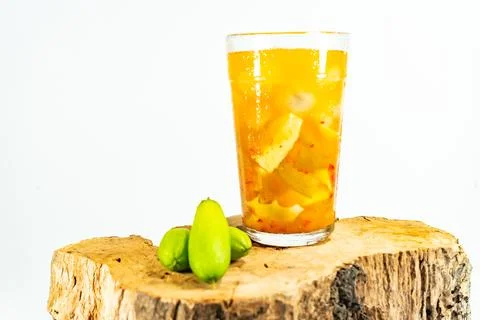 Refreshing tropical fruit pickle featuring sliced young mango, bilimbi, and l Stock Photos