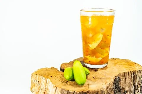 Refreshing tropical fruit pickle featuring sliced young mango, bilimbi, and l Stock Photos