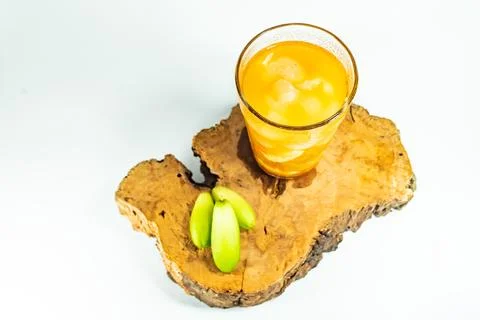 Refreshing tropical fruit pickle featuring sliced young mango, bilimbi, and l Stock Photos