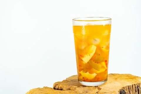 Refreshing tropical fruit pickle featuring sliced young mango, bilimbi, and l Stock Photos