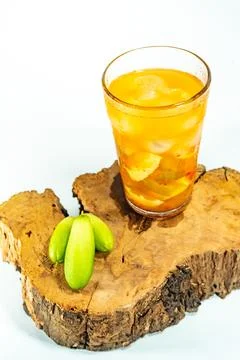Refreshing tropical fruit pickle featuring sliced young mango, bilimbi, and l Stock Photos