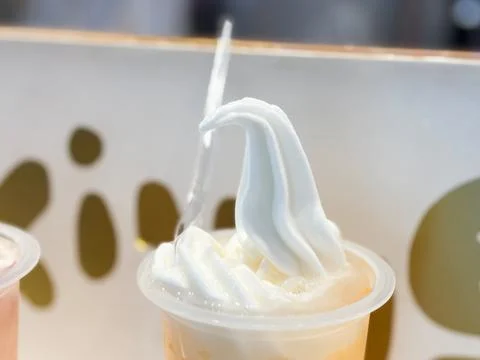 Refreshing Vanilla Soft Serve Ice Cream Swirl on Fruit Smoothie Drink Stock Photos