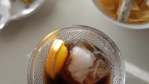 Refreshing vermouth with ice cubes and citrus zest served with tapas like Gildas 스톡 동영상 301861904