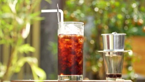 Refreshing Vietnamese Iced Black Coffee in Golden Morning Sun. Stock-Footage 333590750