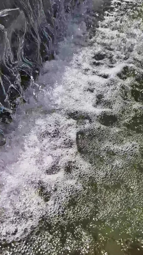 Refreshing Water Splashing and Bubbling in Garden Fountain Pool Stock-Footage 339077988