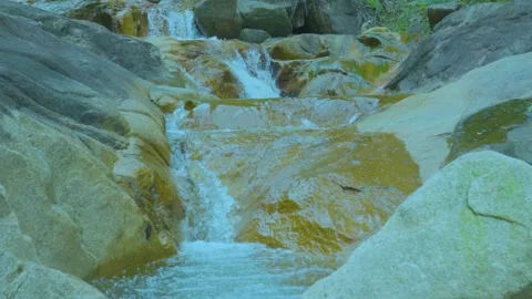 Refreshing Waterfall Cascading Over Smooth Rocks Stock Footage 286936993