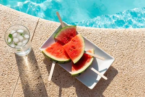 Refreshing Watermelon Popsicles and Mint Water by the Pool Stock Photos