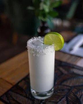 Refreshing white cold shake drink with coconut and lime from colombian restau Photos