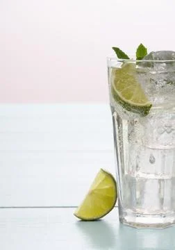 Refreshment cocktail with lime, mint and ice cubes Stock Photos