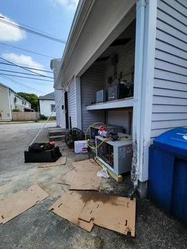 Refrigeration unit shipping container being dropped off at location installed Stock Photos