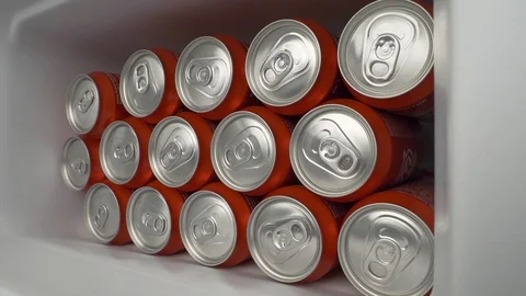 Refrigerator clogged with red cans of soda or beer Stock Footage 106047580