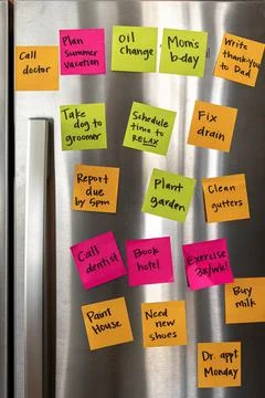 Refrigerator Door Full of Reminder Notes Stock-Fotos