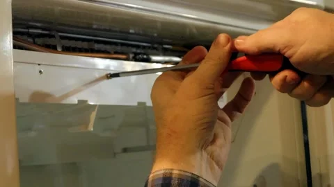 Refrigerator repair tips for common problems with step by step guidance for.. Stock Footage 337360619