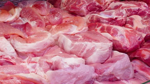 Refrigerator in the store. A pile of raw pork meat. Stock Footage 158333632