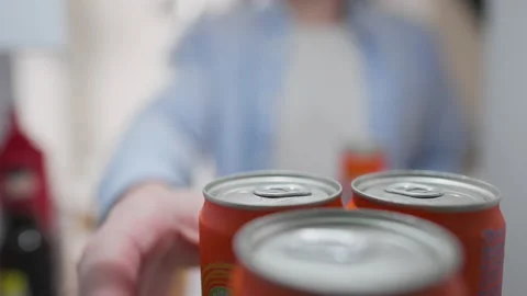 Refrigerator, Young owner Joyfully Takes a metal can of drink from the refri Stock Footage 237193031