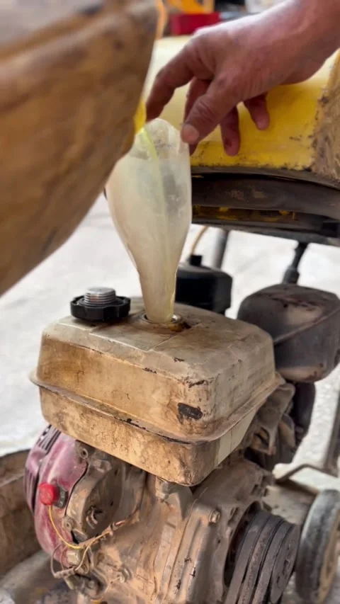 Refueling Asphalt Cutting Machine on Construction Site Stock Footage 323654965