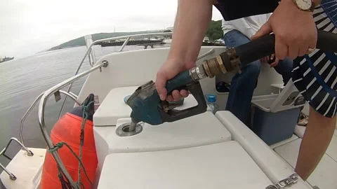 Refueling a boat with an overflow of gasoline Stock Footage 156288009