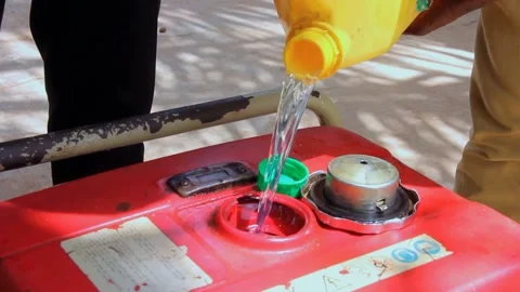 Refueling Electricity  Generator With Petrol During Power Outage In Rural Town Stock Footage 154000091
