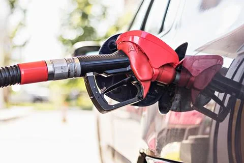 Refueling with gasoline using a gasoline pump car at a gas station Stock Photos