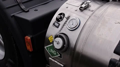 Refueling man inserting filling LNG tap into the gas tank of truck Stock Footage 204095023