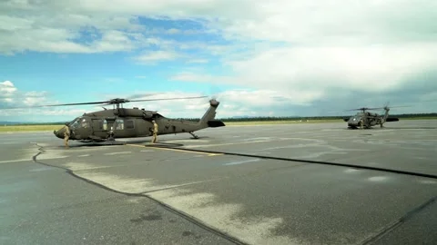 Refueling of Two U.S. Army Blackhawk Helicopters Stock Footage 130361943