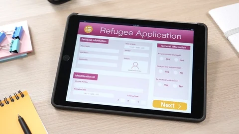 Refugee Application Form On a Tablet PC Touch Screen Stock Footage 89767352