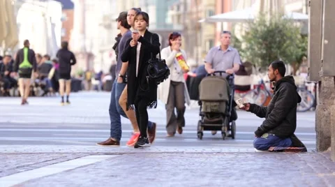 Refugee begging for help in the streets Stock Footage 68162924