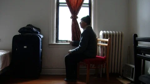 Refugee in the Bronx looking outside of the window Stock Footage 87043597