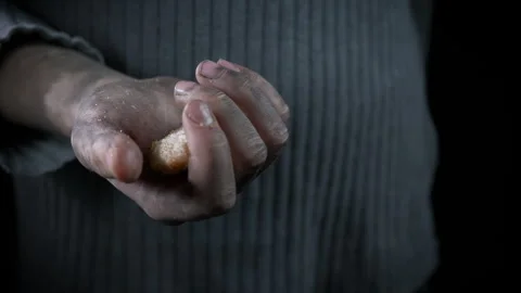 Refugee hand with piece of bread. Stock Footage 290478348