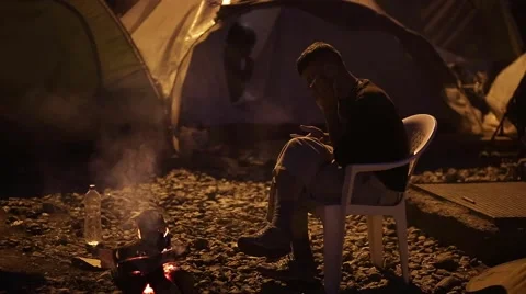 Refugee On His Cell Phone Stock Footage 64847706
